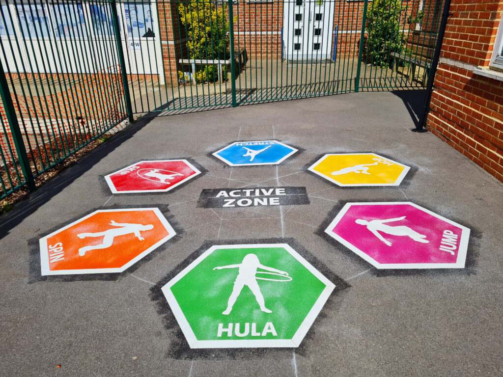 A real Active Zone multi-sports thermoplastic marking installed on a school playground, still bright after daily use