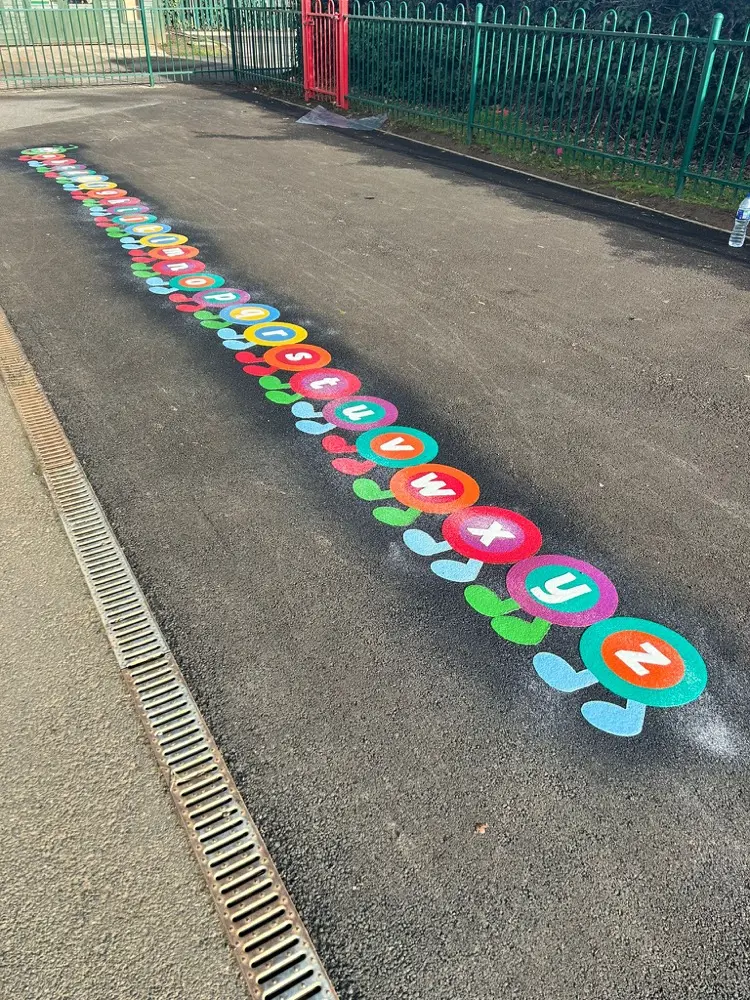 A-Z Caterpillar thermoplastic marking installed on a UK school playground