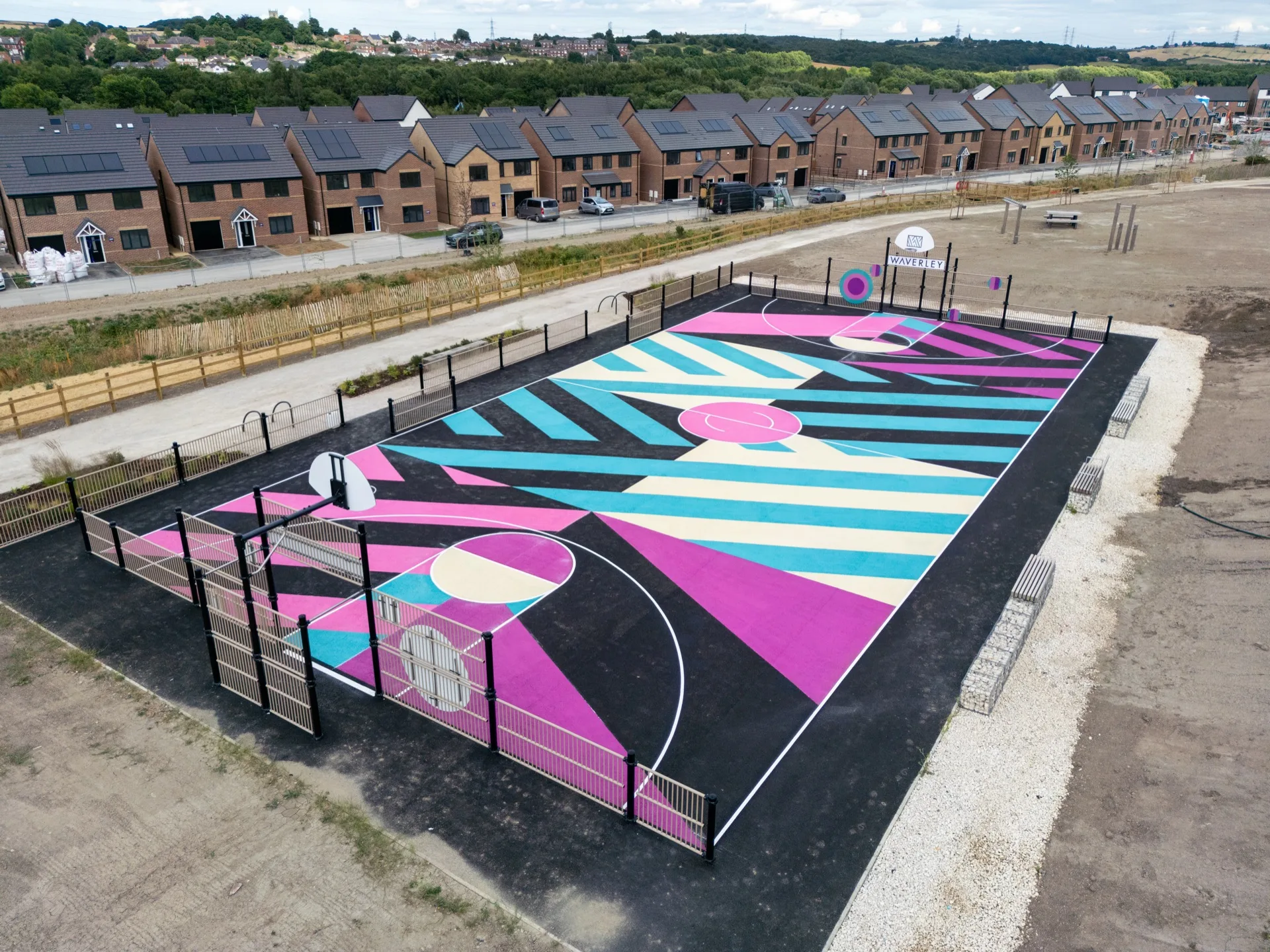 A multi-use games area with coloured sports-court line markings