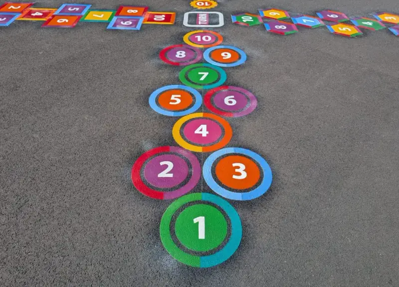 Colourful thermoplastic playground markings installed by Uniplay